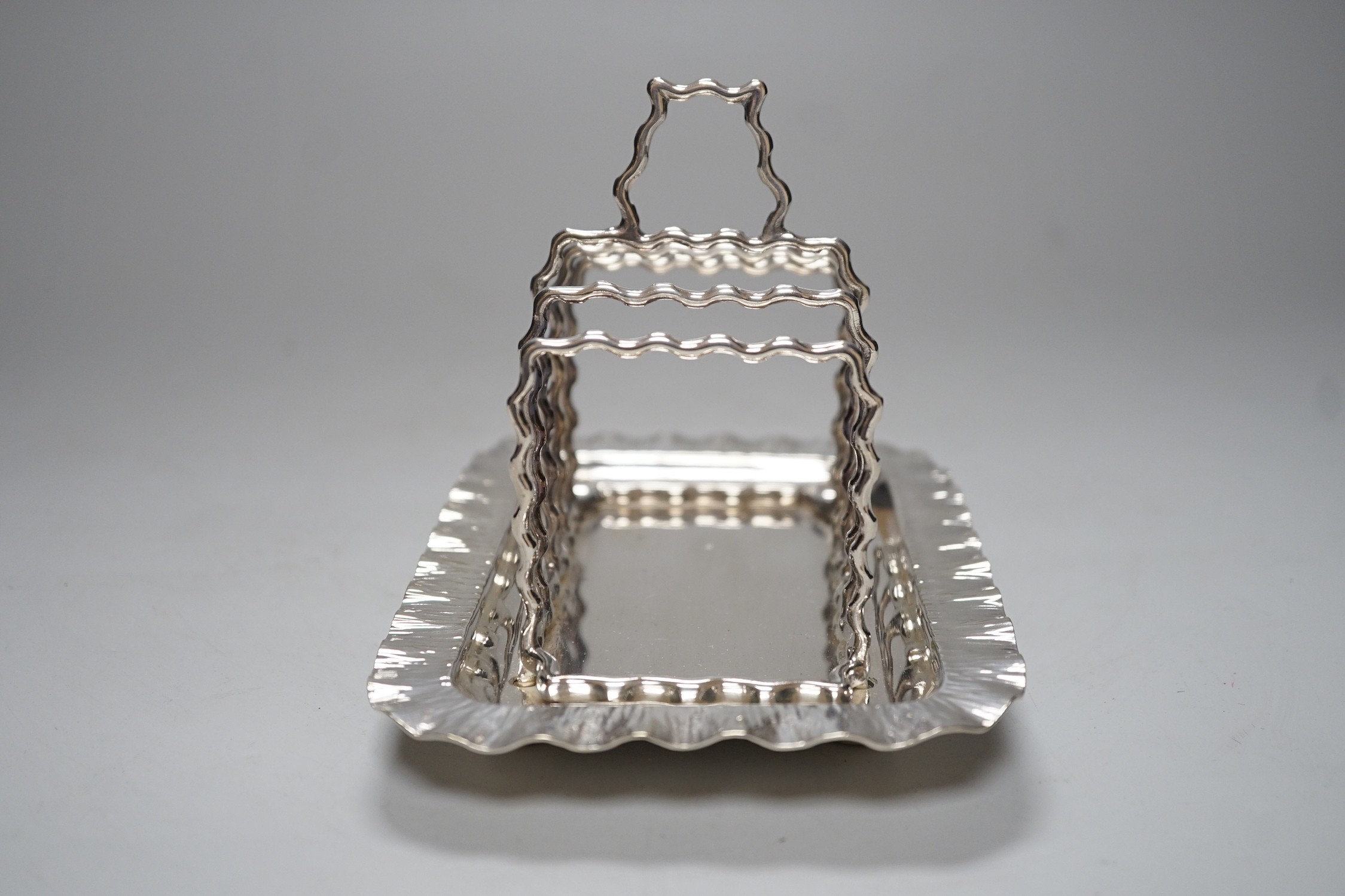 A Hukin & Heath silver plated toast rack, 16cm long